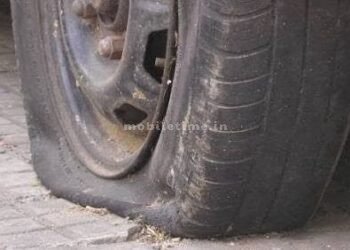 A car sped away from a pothole on the highway!