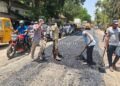 Contractor pours asphalt on cement road!