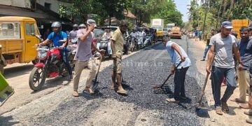 Contractor pours asphalt on cement road!