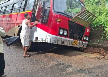 A bus that jumped into a drain!