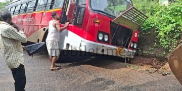 A bus that jumped into a drain!